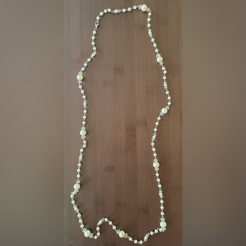 Long strand with pearl-like and clear crystal beads